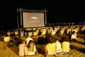 People watching films on the beach at Cannes during the Cannes Film Festival